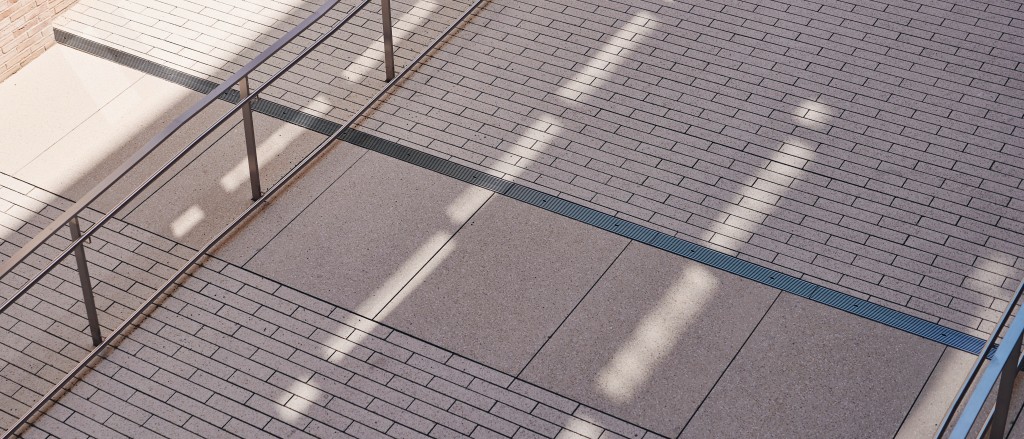 Eine schattige Backsteinstraße auf dem W&W Campus, mit einem Geländer, auf der sich Lichtstreifen reflektieren